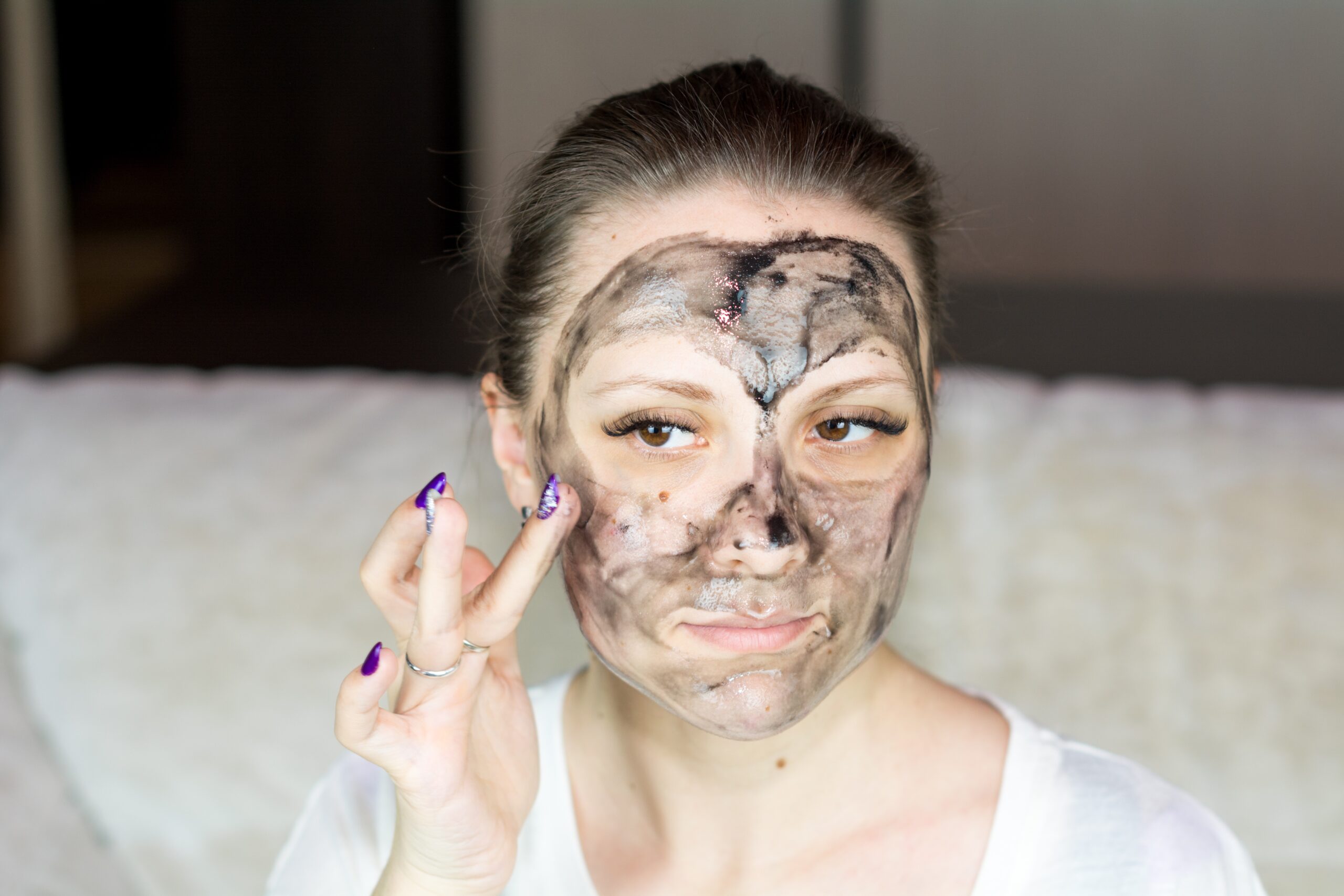 woman applying a mud mask